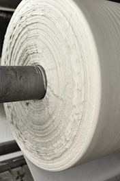 A roll of white paper sitting on top of a machine