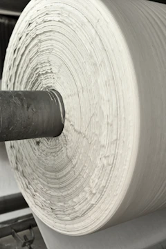 A roll of white paper sitting on top of a machine