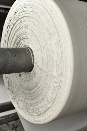 A roll of white paper sitting on top of a machine