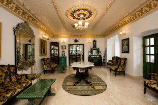 A living room filled with furniture and a chandelier