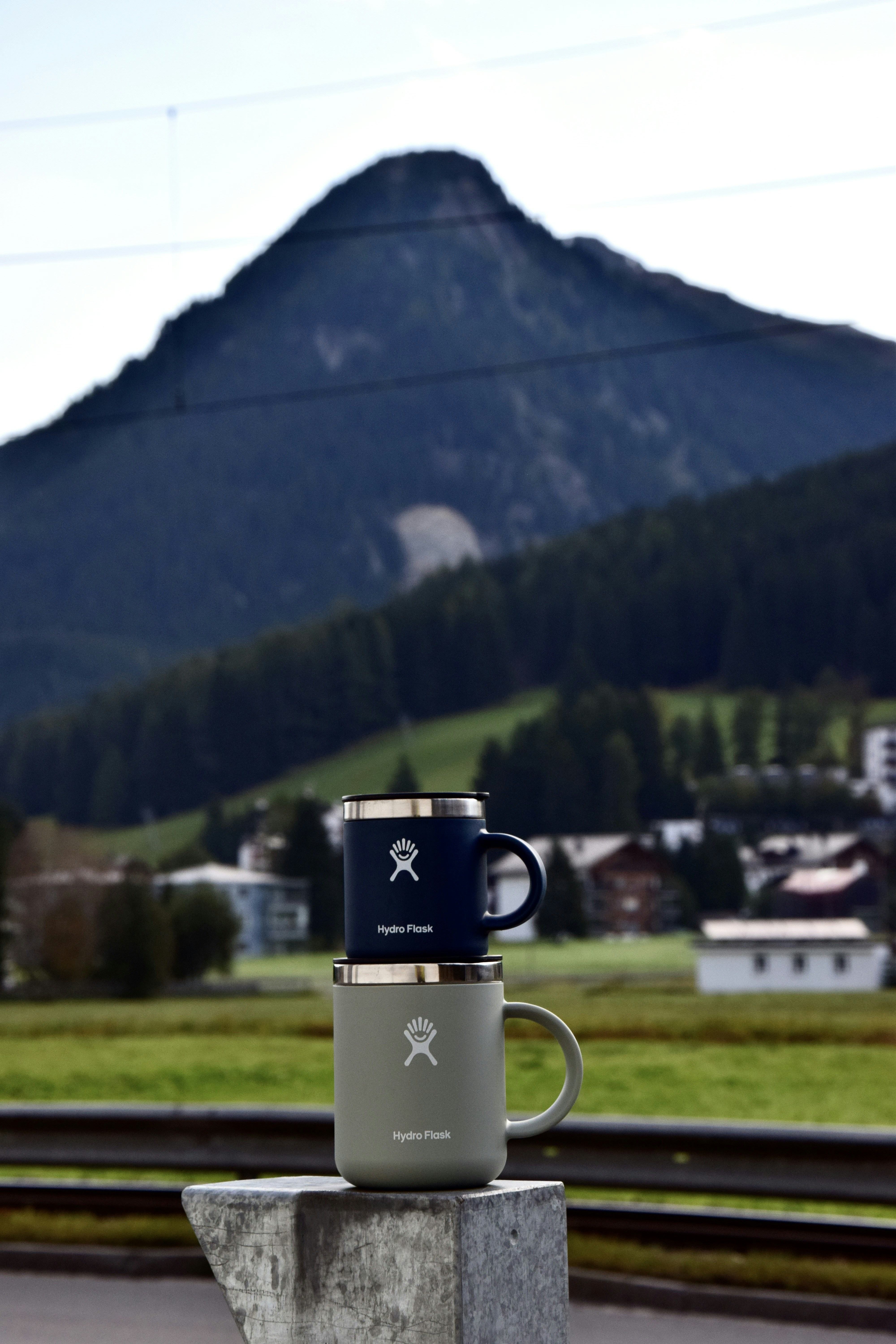 A coffee cup sitting on top of a cement block