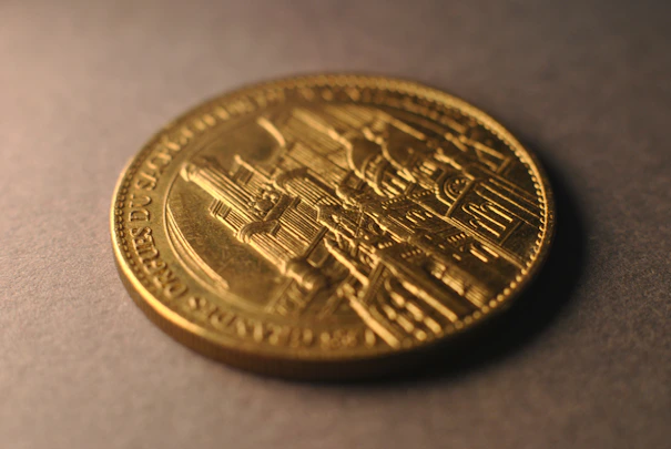 A close up of a gold coin on a table