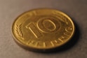 A close up of a ten cents coin
