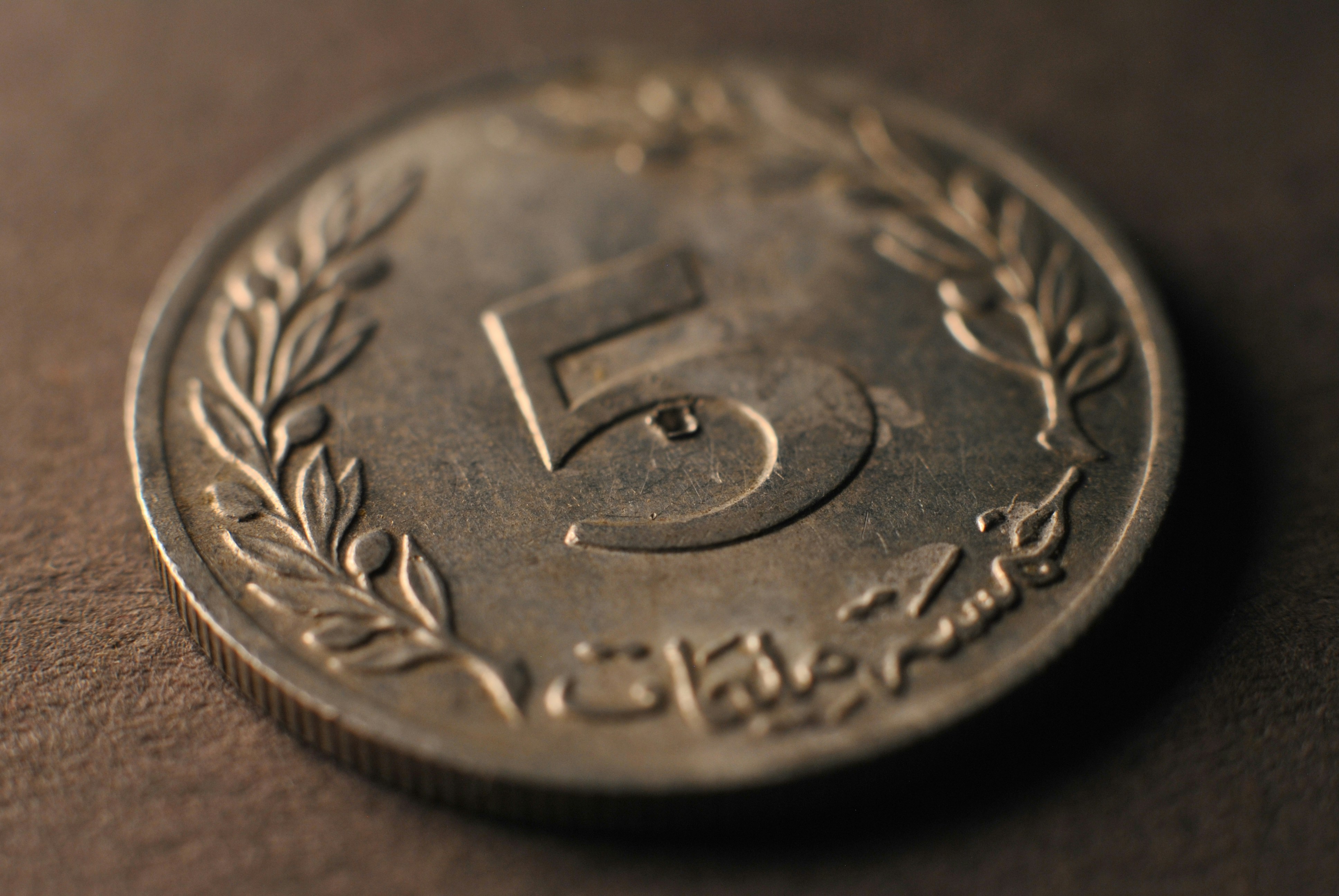 A close up of a coin on a table
