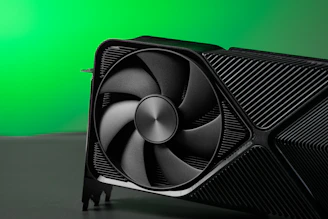 A close up of a computer fan on a table