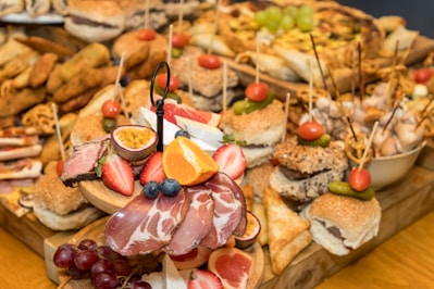 A wooden table topped with lots of food