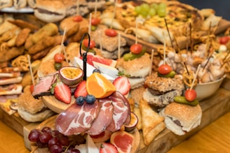 A wooden table topped with lots of food