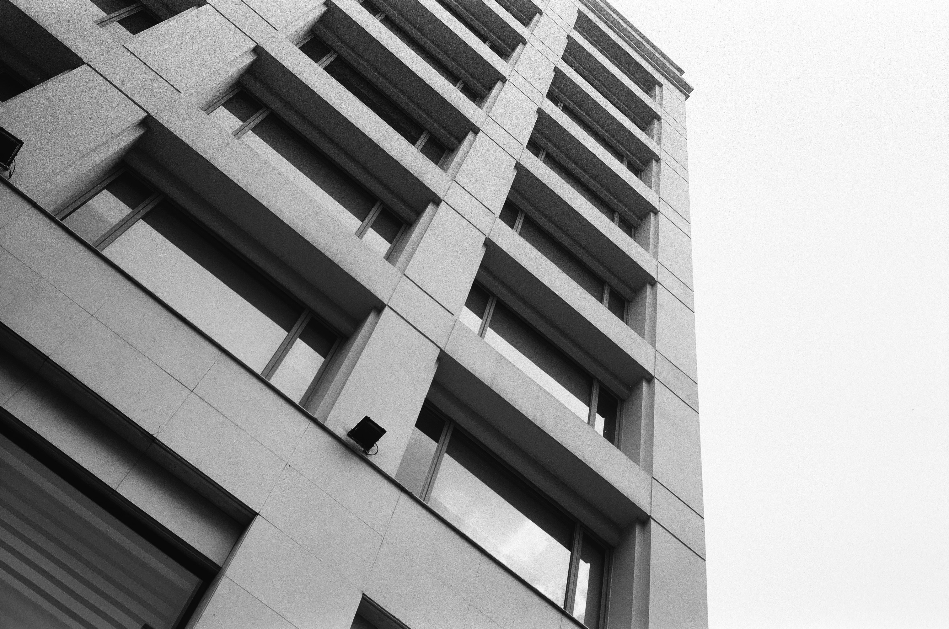 A black and white photo of a tall building