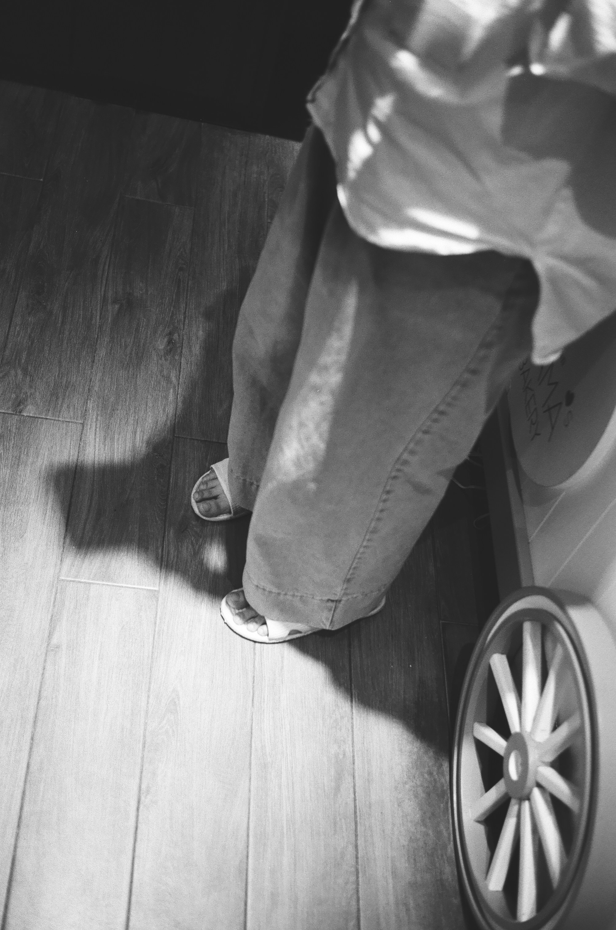 A person standing on top of a bathroom scale
