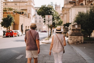 A man and a woman walking down a street