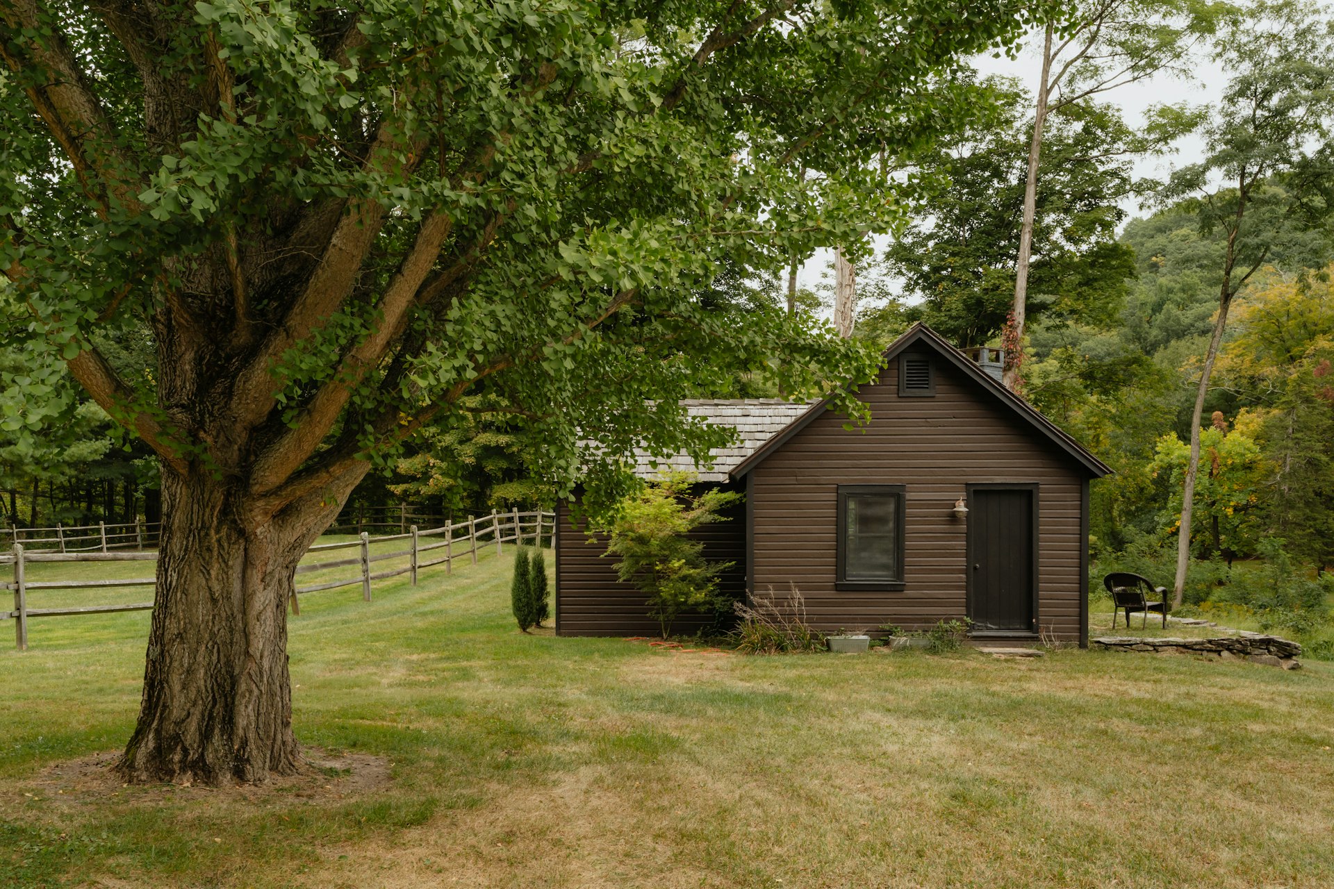 Small portable cabin building in field