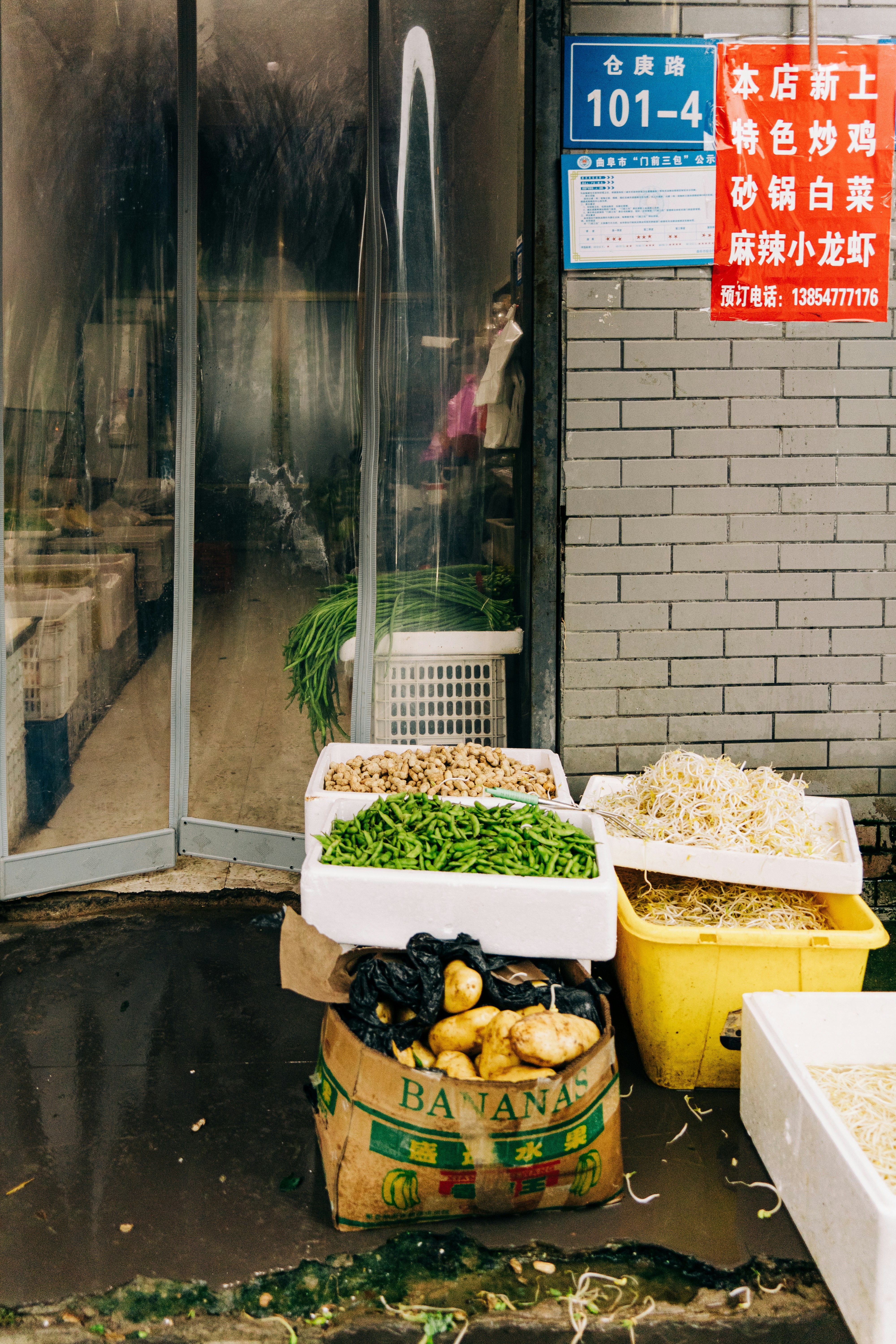 A bunch of boxes of food sitting outside of a building