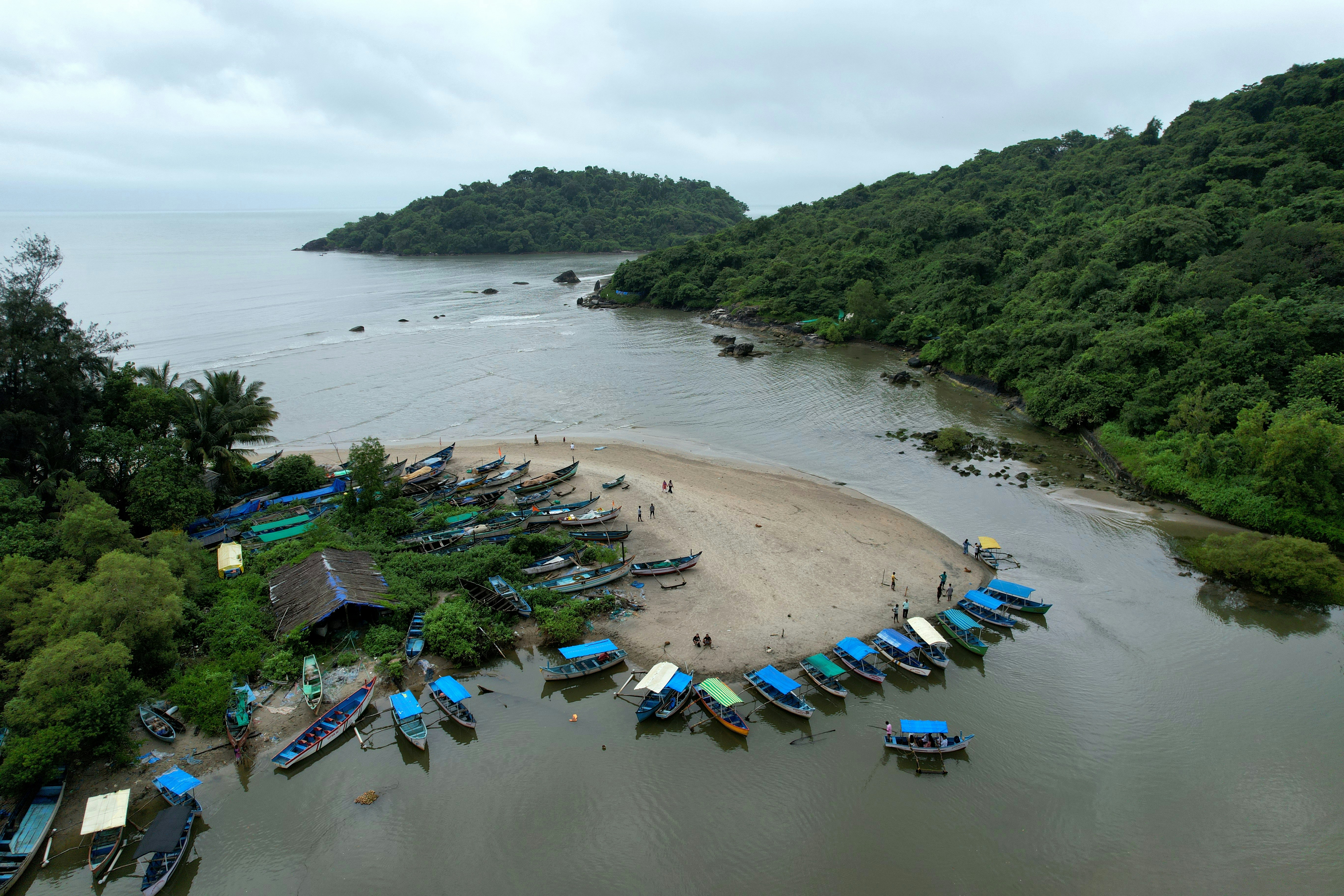 Backwaters of Palolem Beach in South Goa, India. It is filled with colorful fishing and boats that show tourists around.