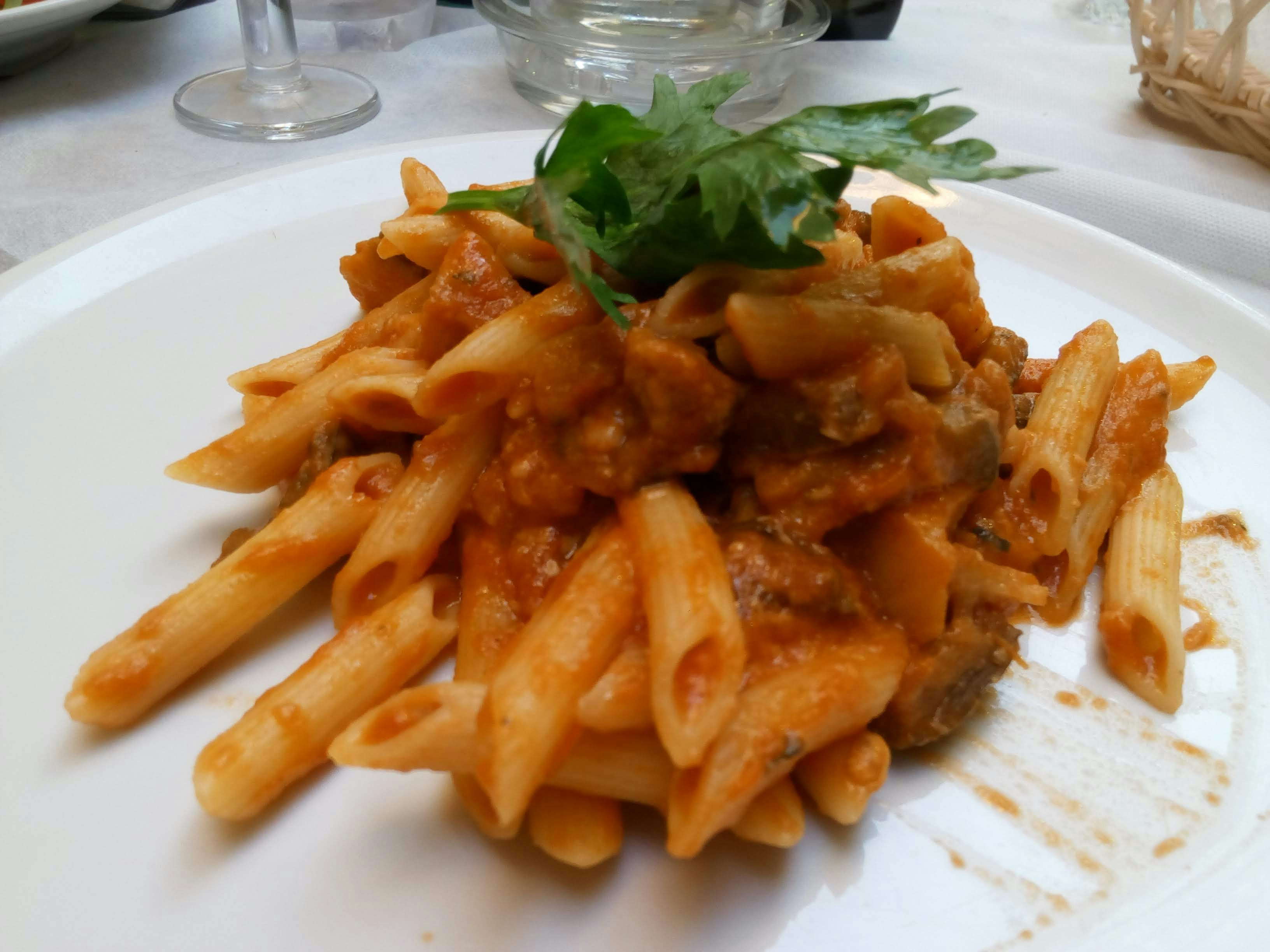 Penne all'Arrabbiata - Penne in a fiery tomato sauce with garlic, red chili, fresh 