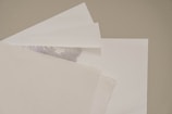 A pile of white paper sitting on top of a table