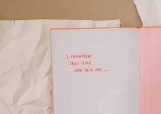 A pink and white book with writing on it