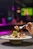 A person eating a plate of food with a fork
