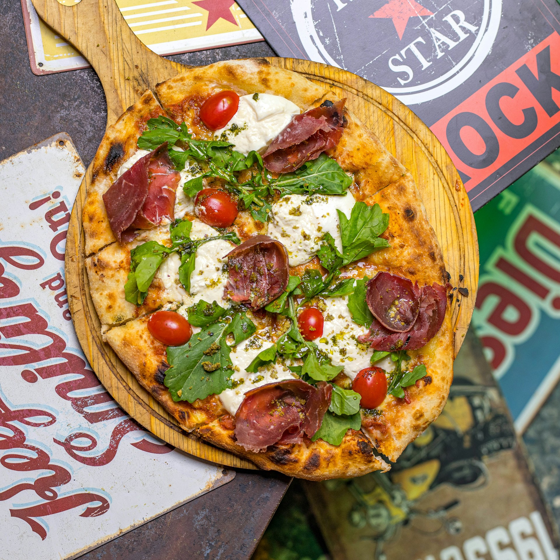A pizza sitting on top of a wooden cutting board