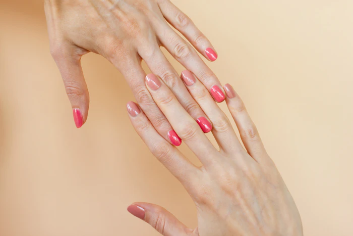 Hands with a soft pink manicure