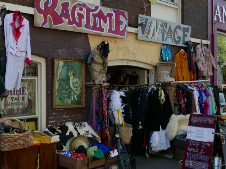 A store front with clothes and other items on display