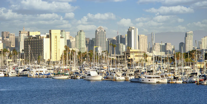 Harbor with boats and city buildings