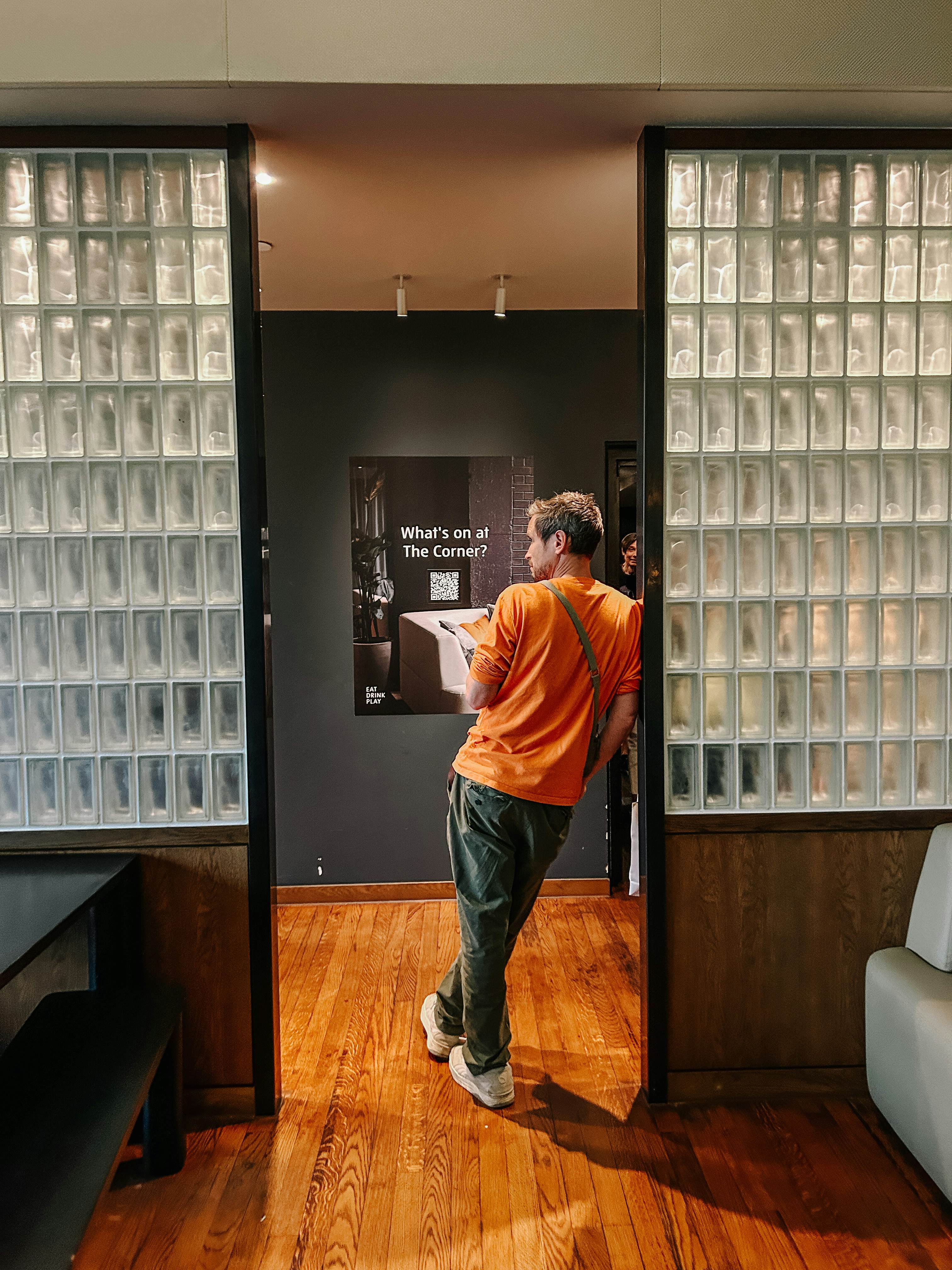 A man standing in front of a glass block wall photo – Free Indoors ...