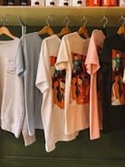 A bunch of shirts hanging on a rack