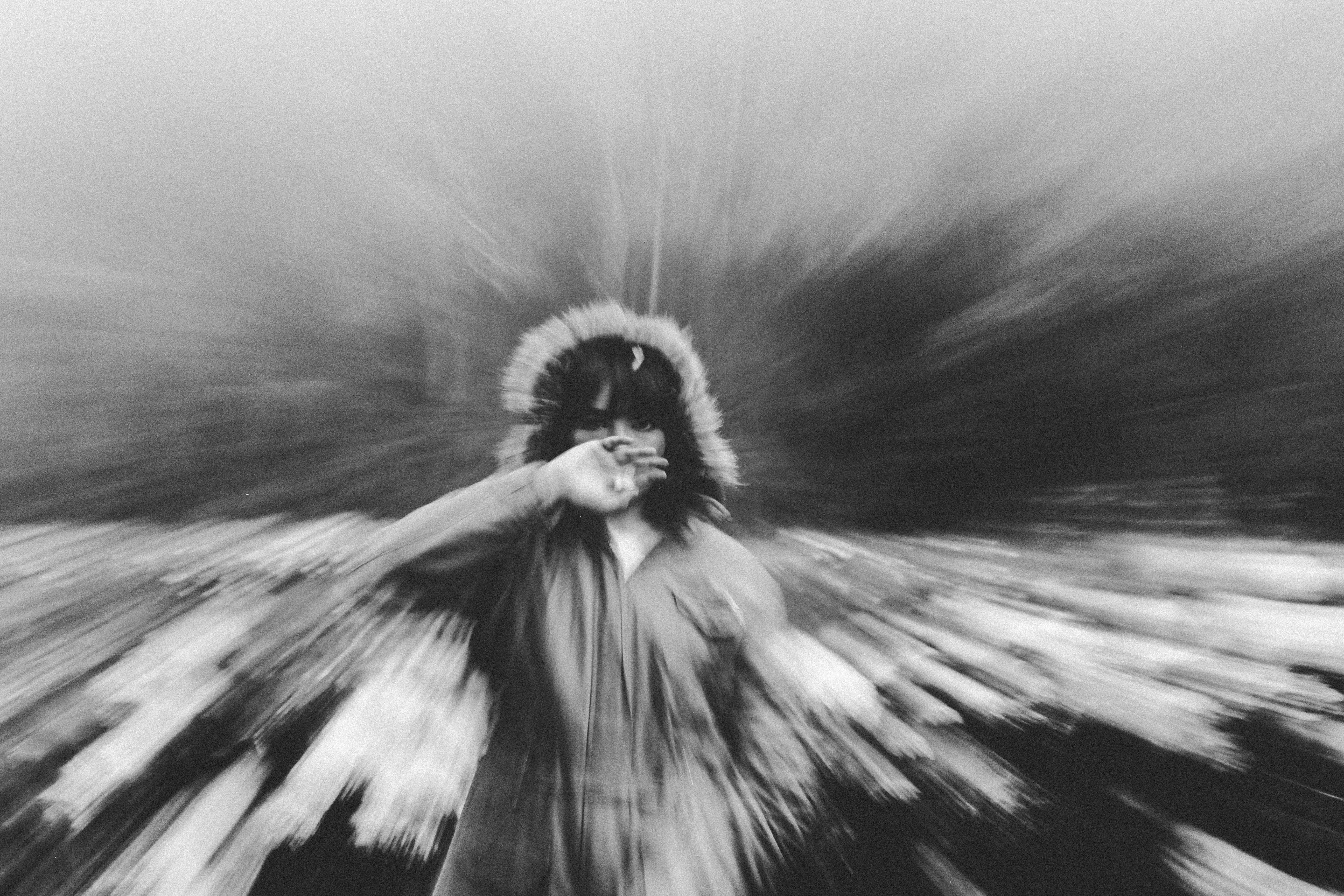 A black and white photo of a person with wings