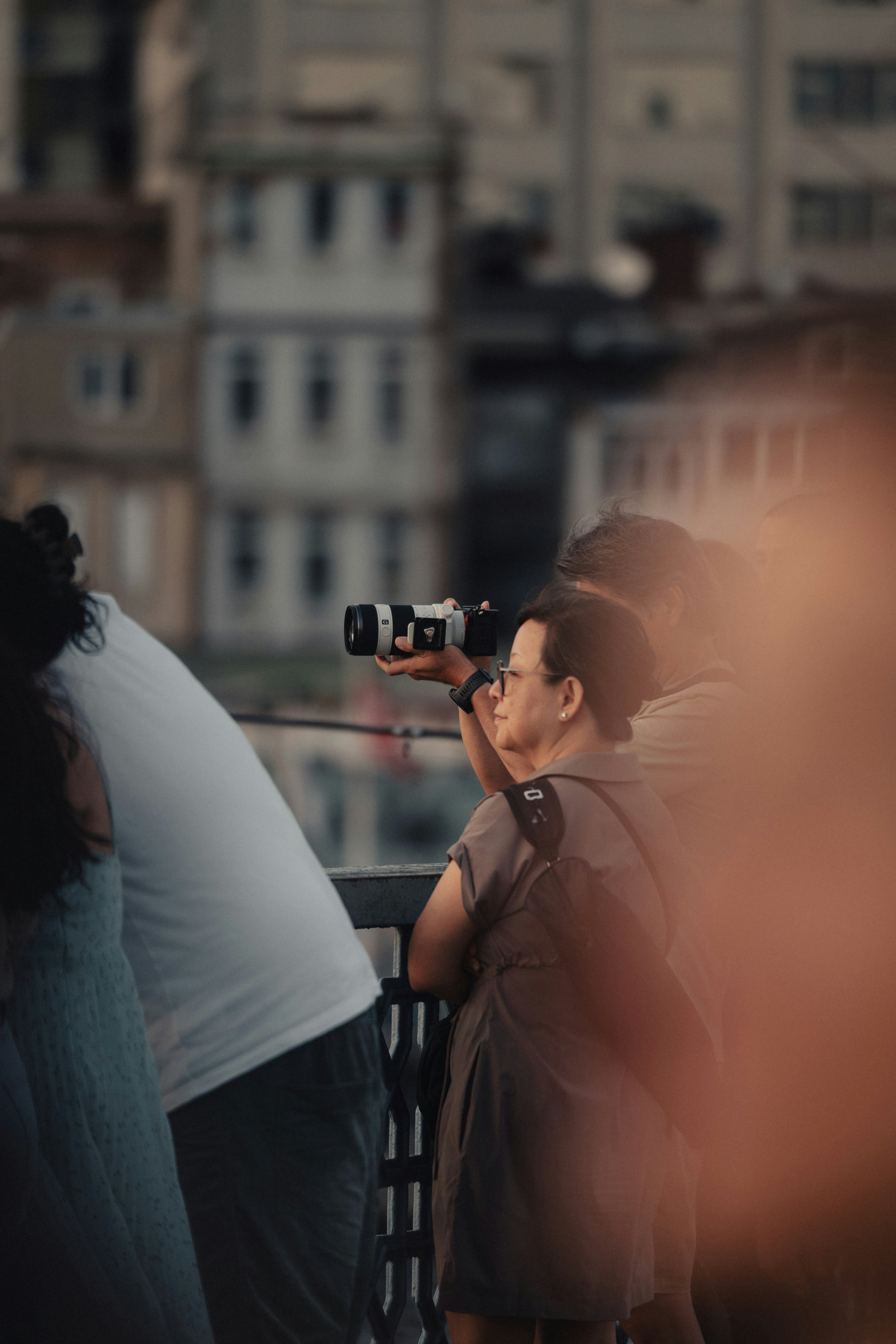 A man taking a picture of a woman with a camera