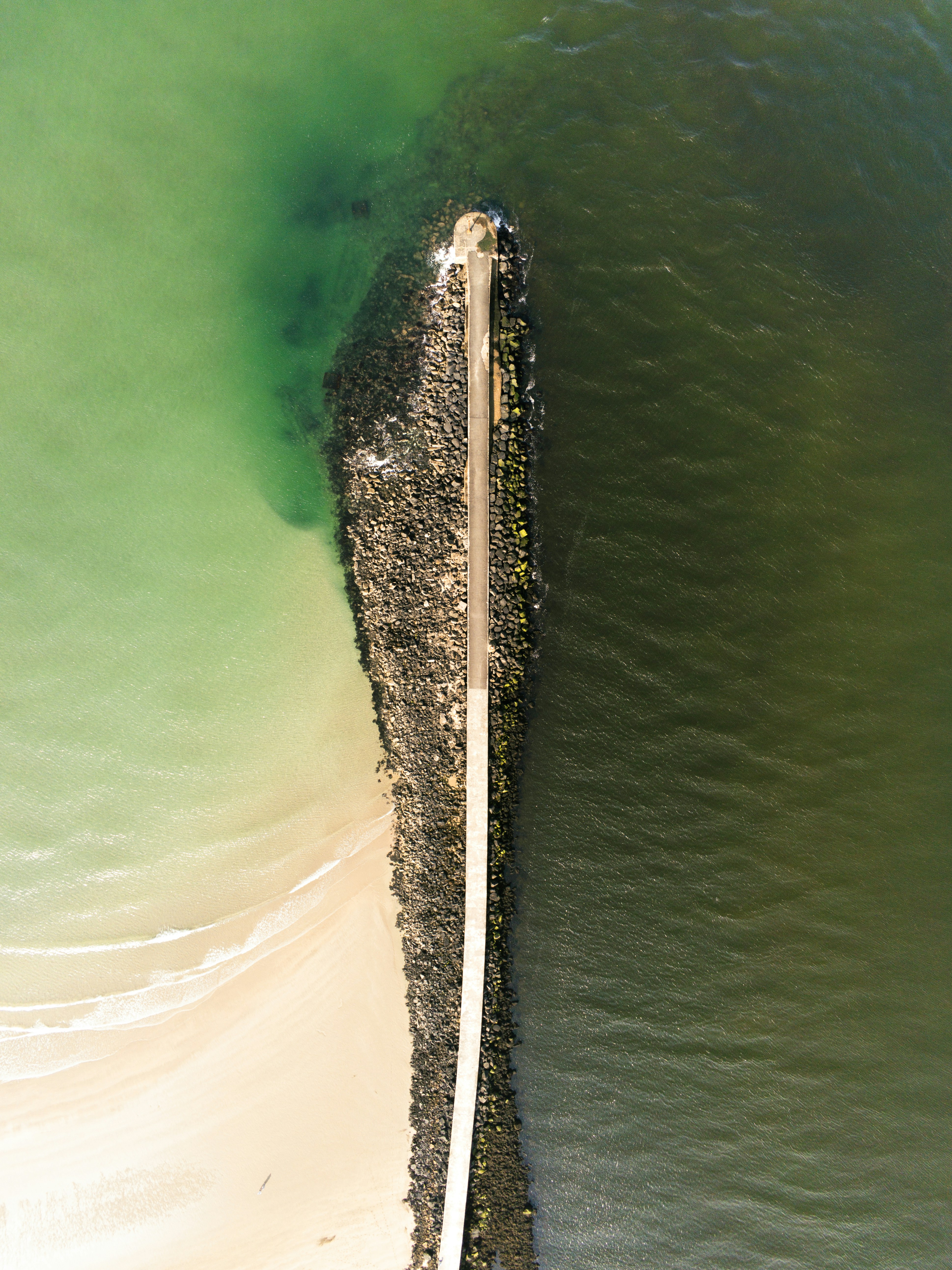 An aerial view of a pier in the water