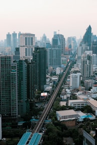 A view of a city with a train on the tracks