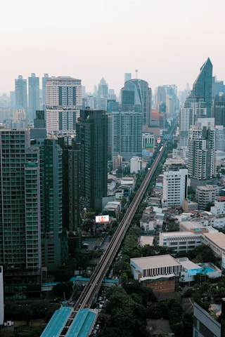 A view of a city with a train on the tracks