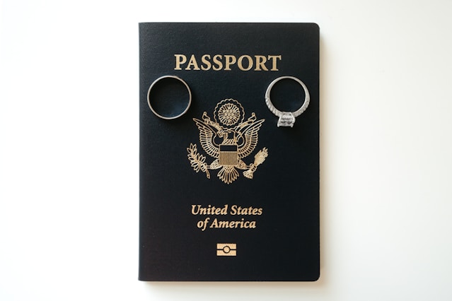 A passport with two key chains attached to it
