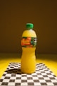 A plastic bottle sitting on top of a checkered table