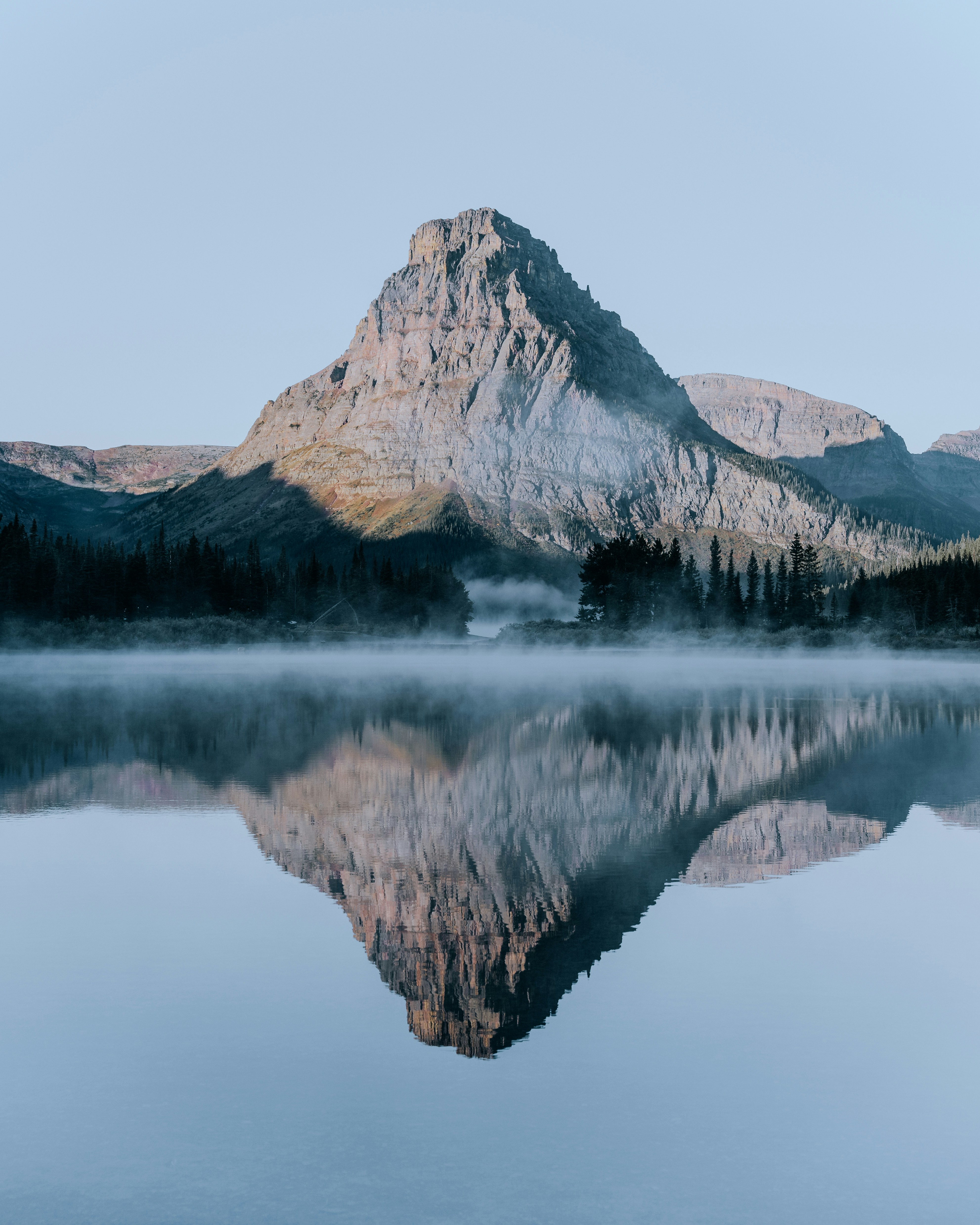 A mountain with a lake in front of it