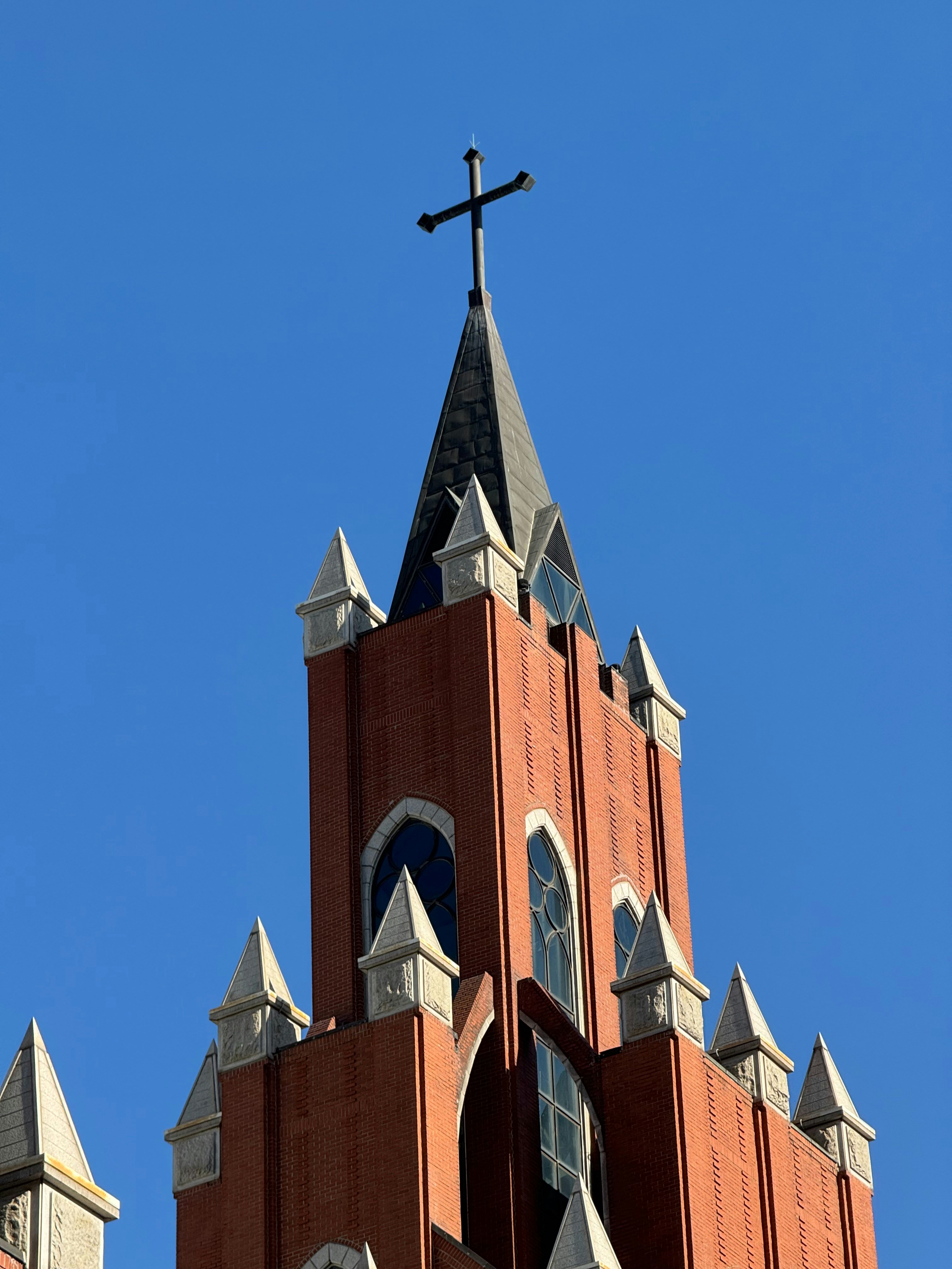 A church steeple with a cross on top