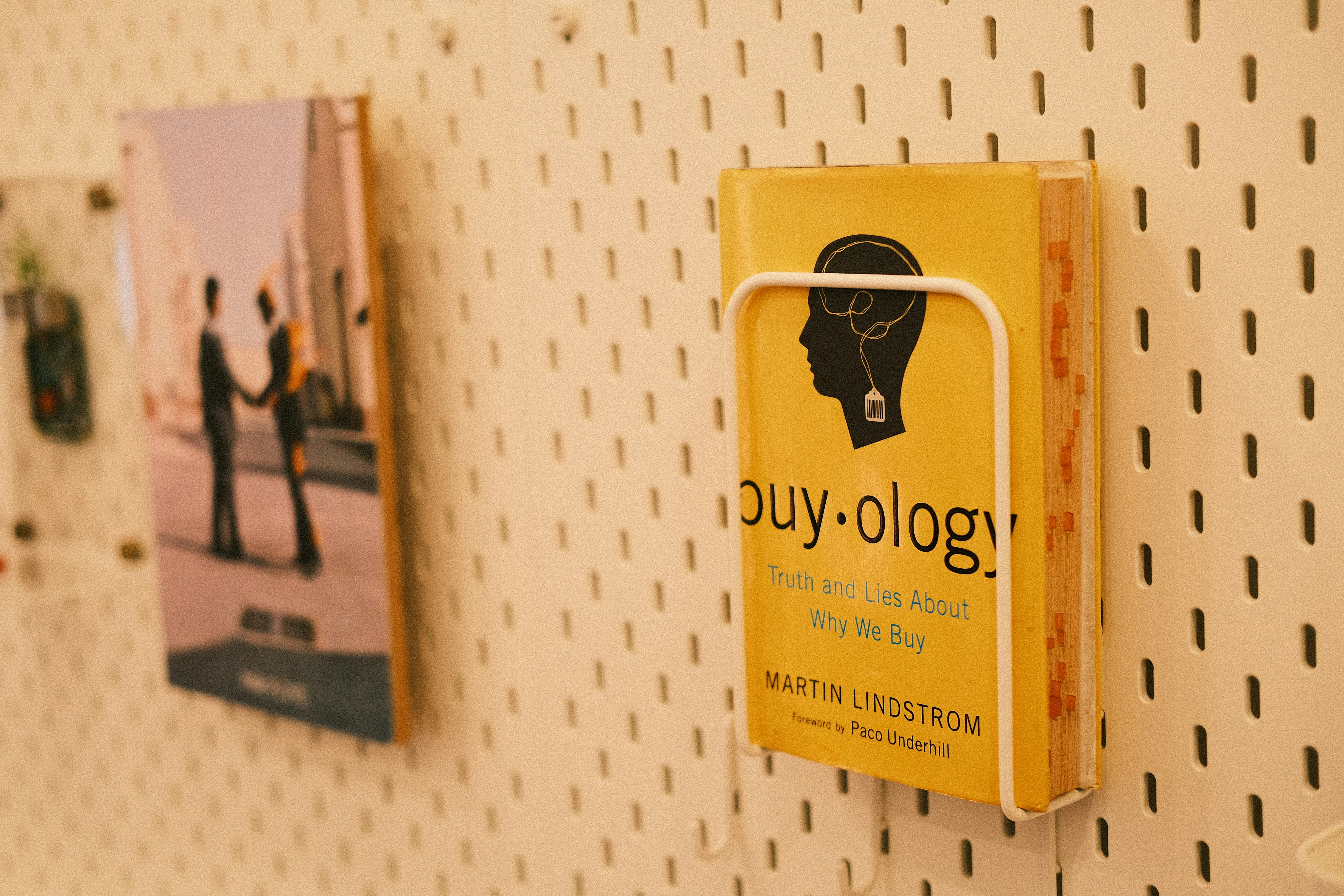 A yellow box hanging on a white wall