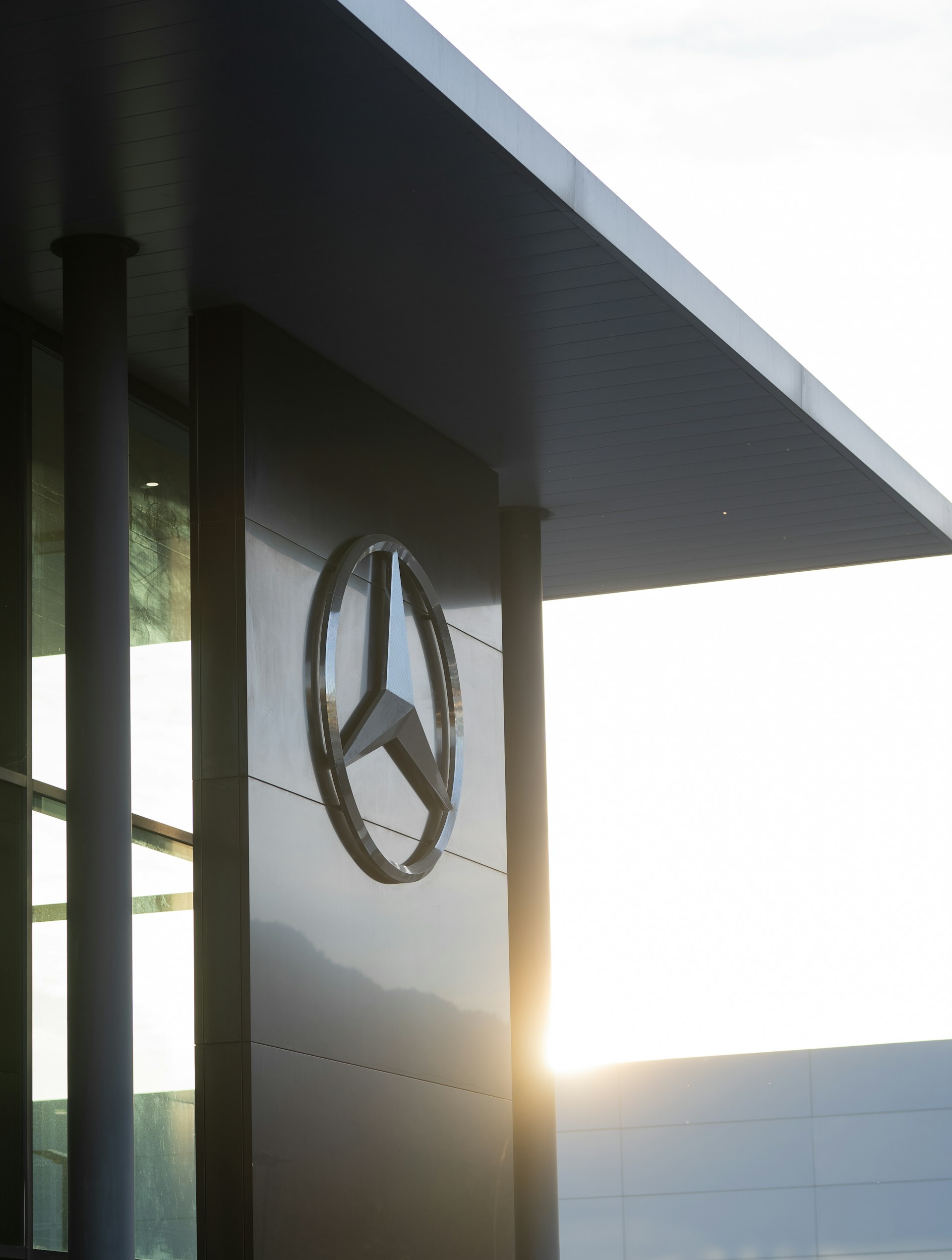 A mercedes logo on the side of a building