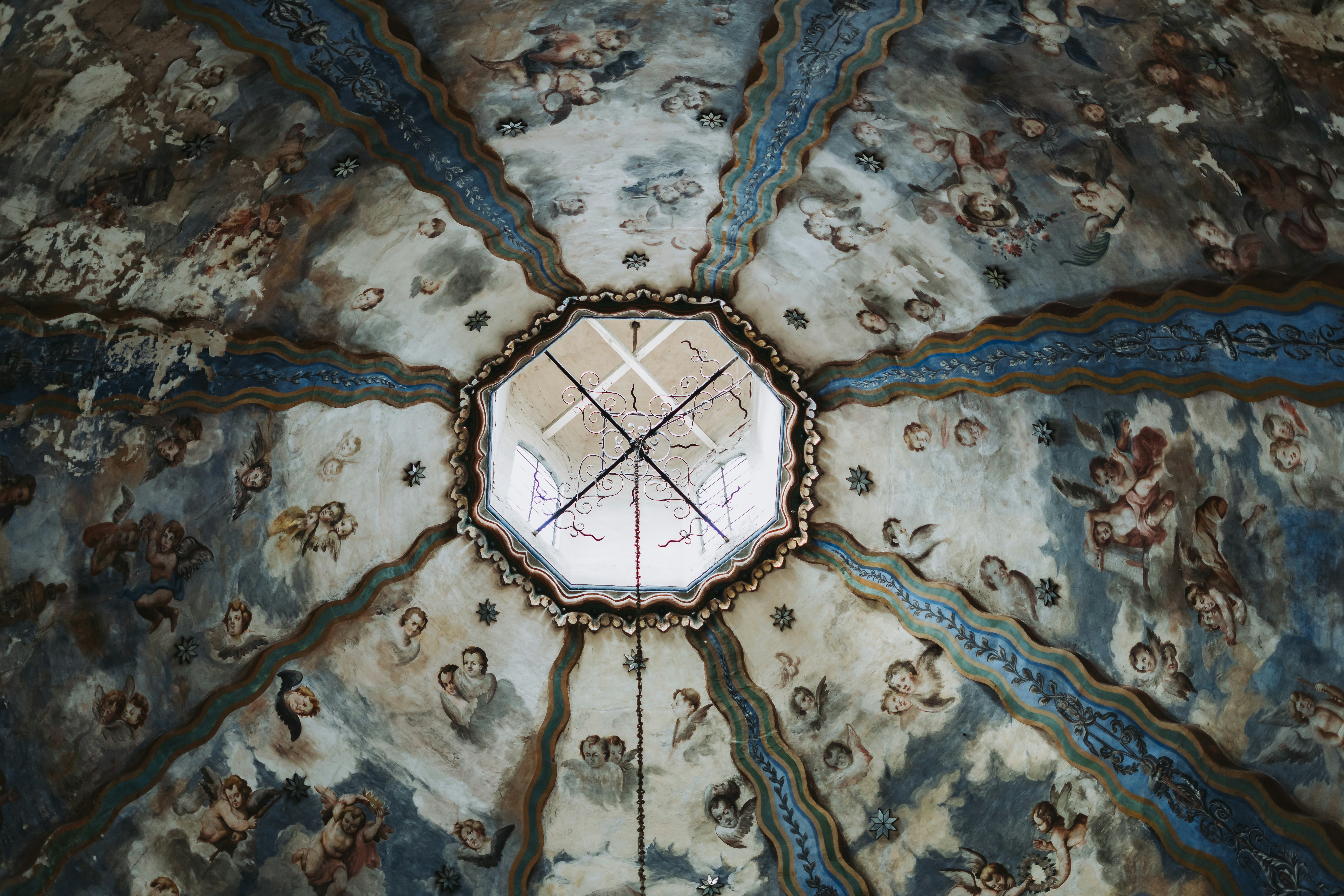 A close up of a ceiling with a cross on it