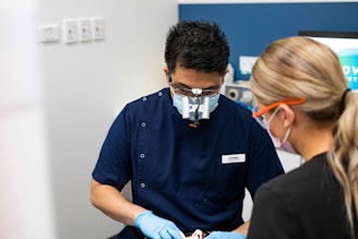 A man in a dentist's office with a woman