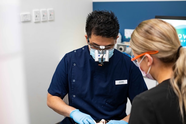 A man in a dentist's office with a woman