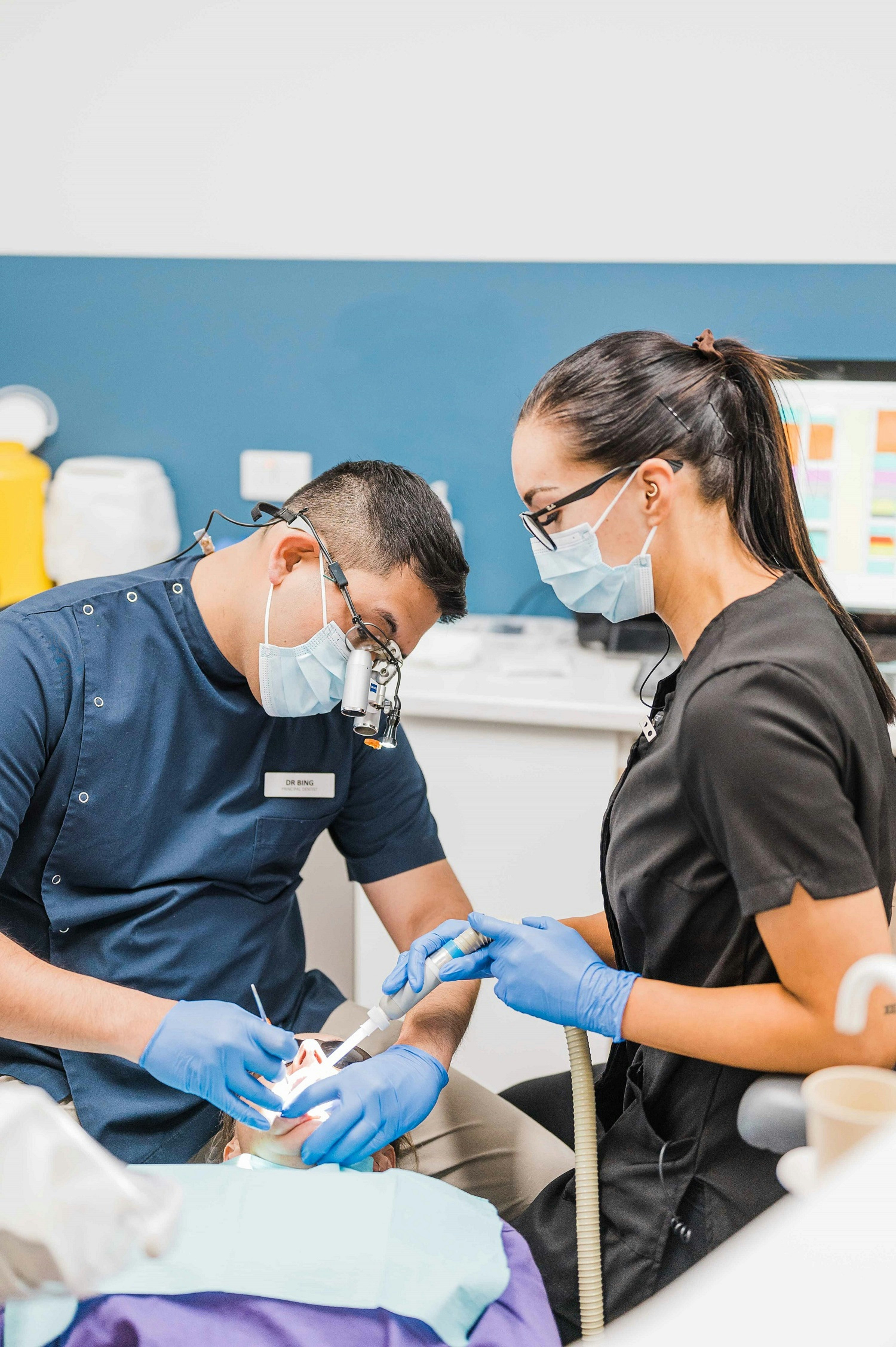 A man and a woman in a dentist's office
