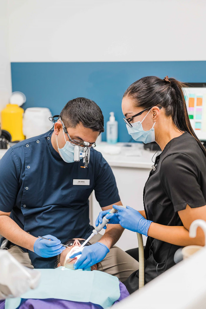 Dentist and assistant at work