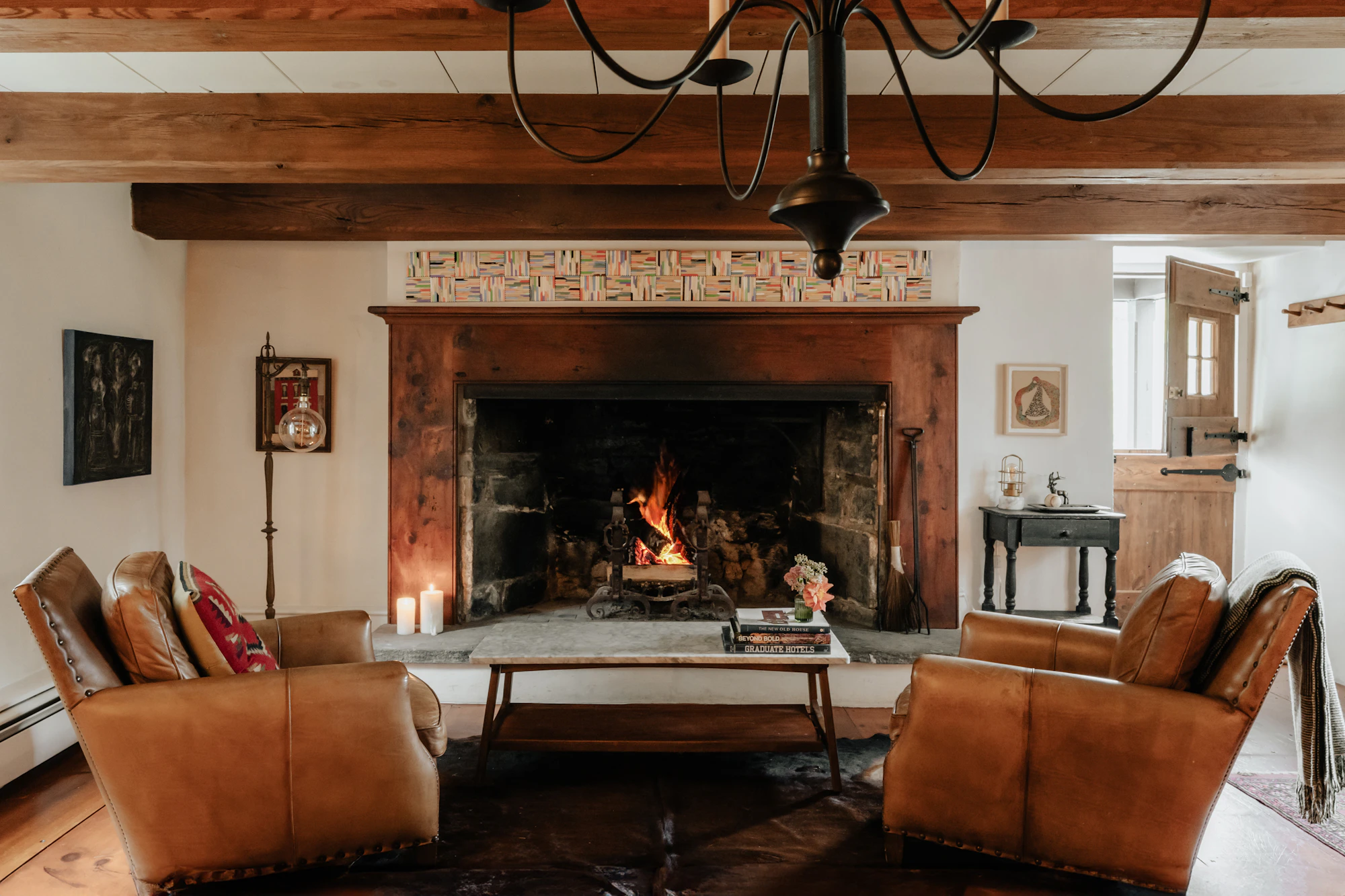 A wood fire burning in a farmhouse living room fireplace