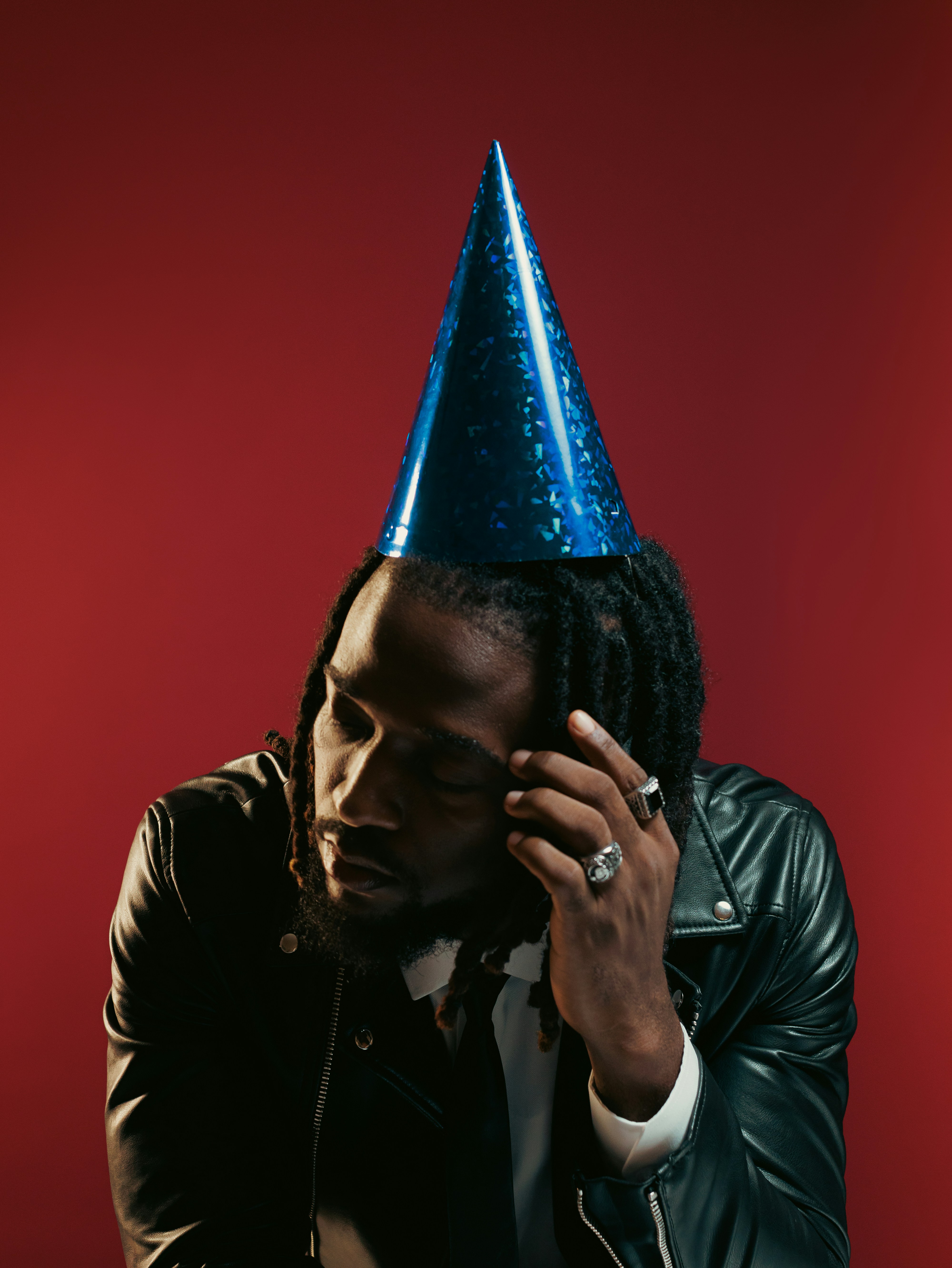 A man with a party hat on his head