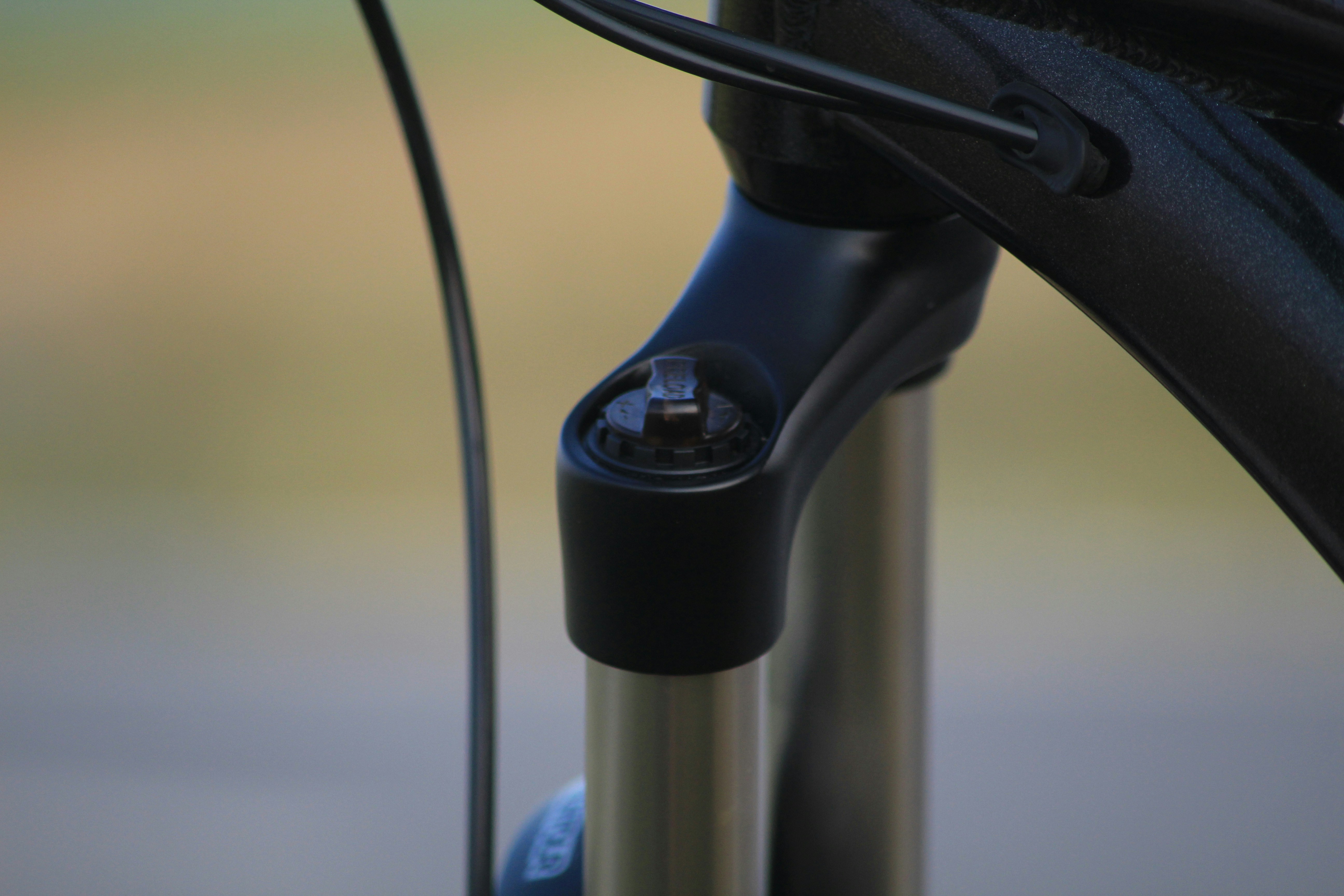 Close-up of an EV fast-charging connector and adapter similar to Tesla Magic Dock hardware