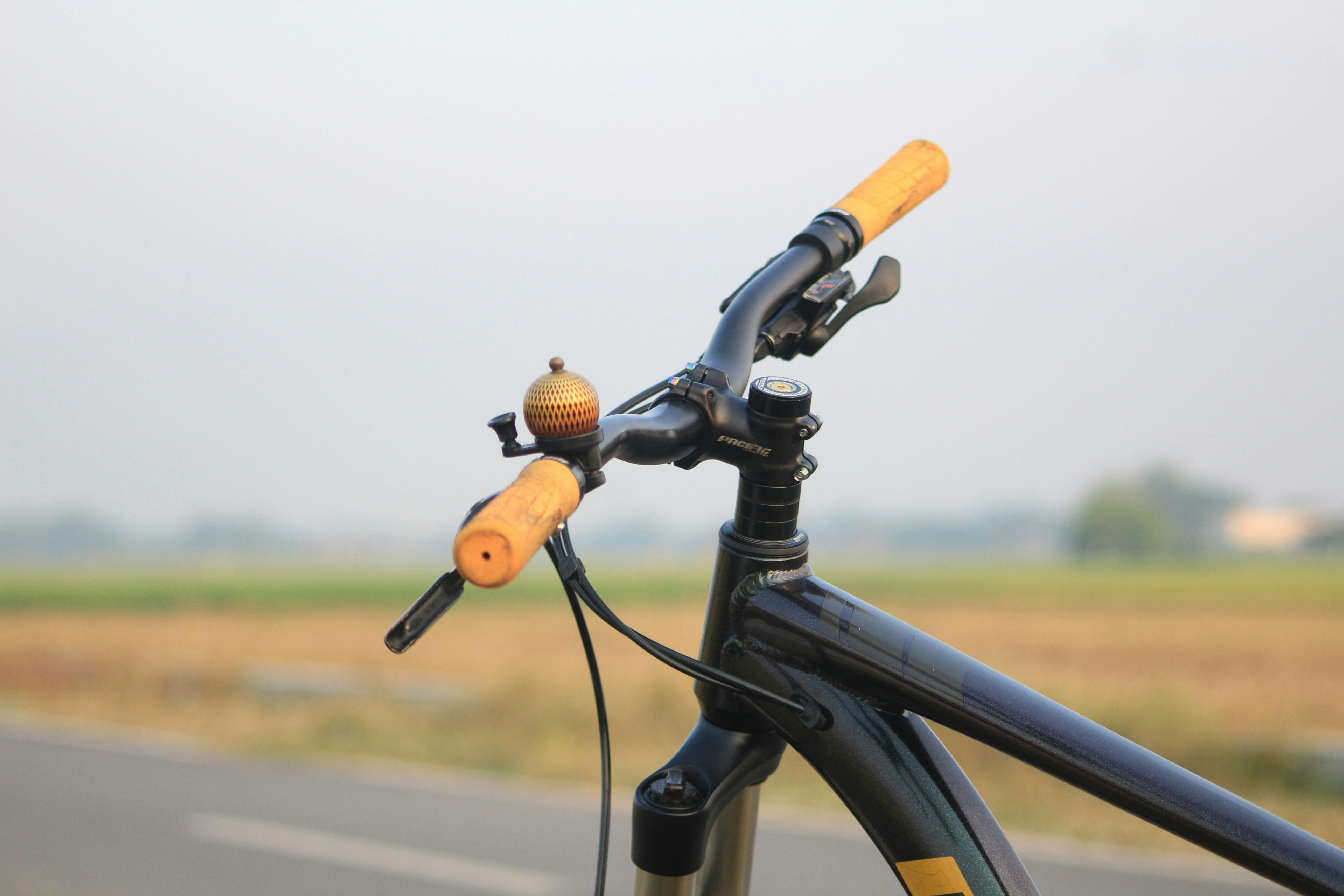 A close up of a bicycle on the side of the road