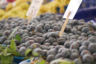A bunch of blueberries are on display at a market
