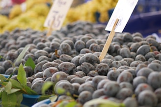 A bunch of blueberries are on display at a market
