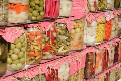 A shelf filled with lots of different types of food